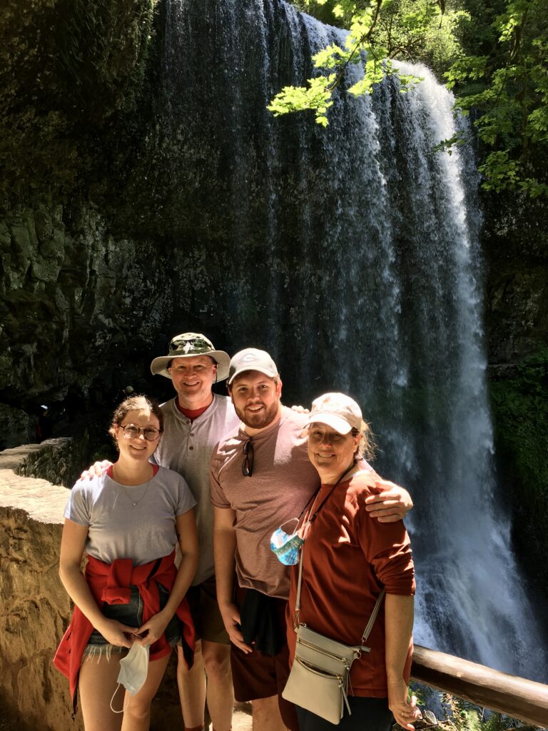 David and his immediate family by a waterfall